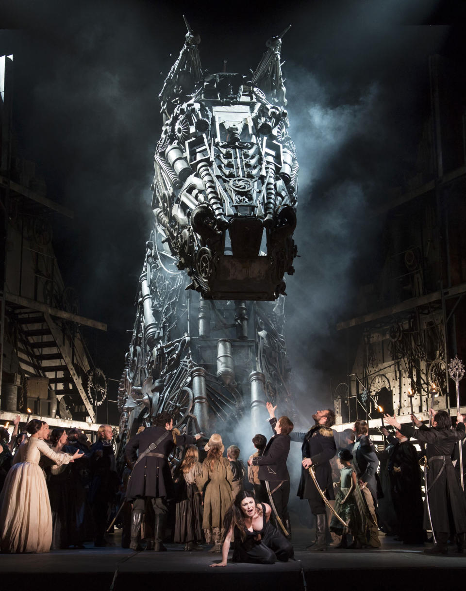 In this image released by the Royal Opera house in London, Monday, June 25, 2012 show the cast of the opera Les Troyens, taken on Friday, June 22, 2012. The version by director David McVicar which premiered Monday, June 25 marks the first time the company has performed the full opera in 40 years. It's an official event of the London 2012 Festival being held in conjunction with the Olympics _ and set designer Es Devlin is also designing the closing ceremony for the Games. (AP Photo/Bill Cooper, Royal Opera House)