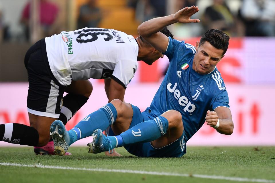 Juventus' Portuguese forward Cristiano Ronaldo (R) reacts after missing a goal opportunity during the Italian Serie A football match Parma vs Juventus on August 24, 2019 at the Ennio-Tardini stadium in Parma. (Photo by Marco Bertorello / AFP)        (Photo credit should read MARCO BERTORELLO/AFP/Getty Images)