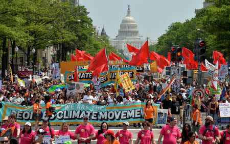 Demonstrators march down Pennsylvania Avenue during a People's Climate March, to protest U.S. President Donald Trump's stance on the environment, in Washington, U.S., April 29, 2017. REUTERS/Mike Theiler