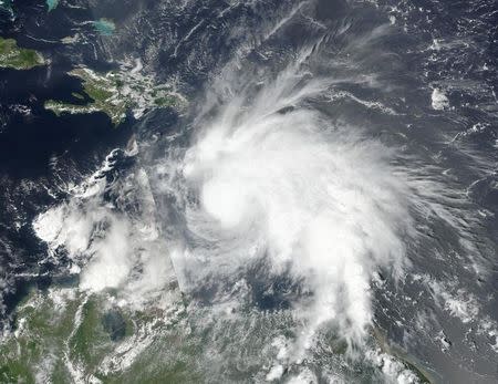 Tropical Storm Matthew, which has since gained hurricane strength, is seen in an image captured by NASA-NOAA's Suomi NPP satellite at 1pm ET (17:00 GMT) September 29, 2016. NOAA/NASA Goddard MODIS Rapid Response Team/Handout via REUTERS