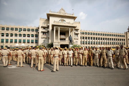 Police personnel maintain vigil outside the Vidhana Soudha, the legislative house of the southern state of Karnataka during a vote of confidence motion against the ruling Bharatiya Janata Party's (BJP) B. S. Yeddyurappa's government in Bengaluru, India, May 19, 2018. REUTERS/Abhishek N. Chinnappa