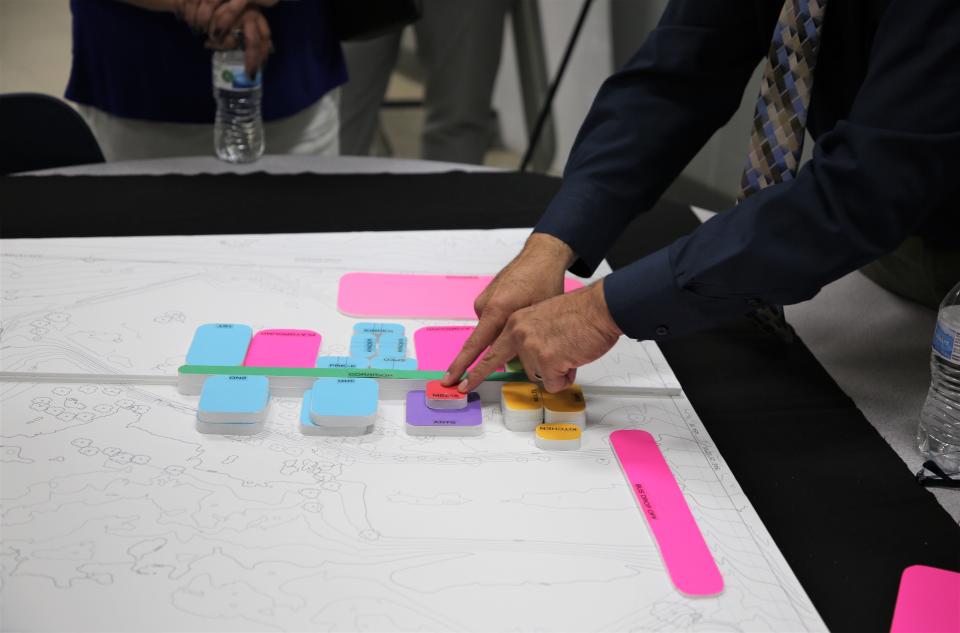 Architect Ray Vigil presents topographical maps to demonstrate design concepts as part of an interactive session hosted by the Las Cruces Public Schools seeking input into the design of the new Columbia Elementary School. The meeting was held at Vista Middle School in Las Cruces on Wednesday, Aug. 31, 2022.