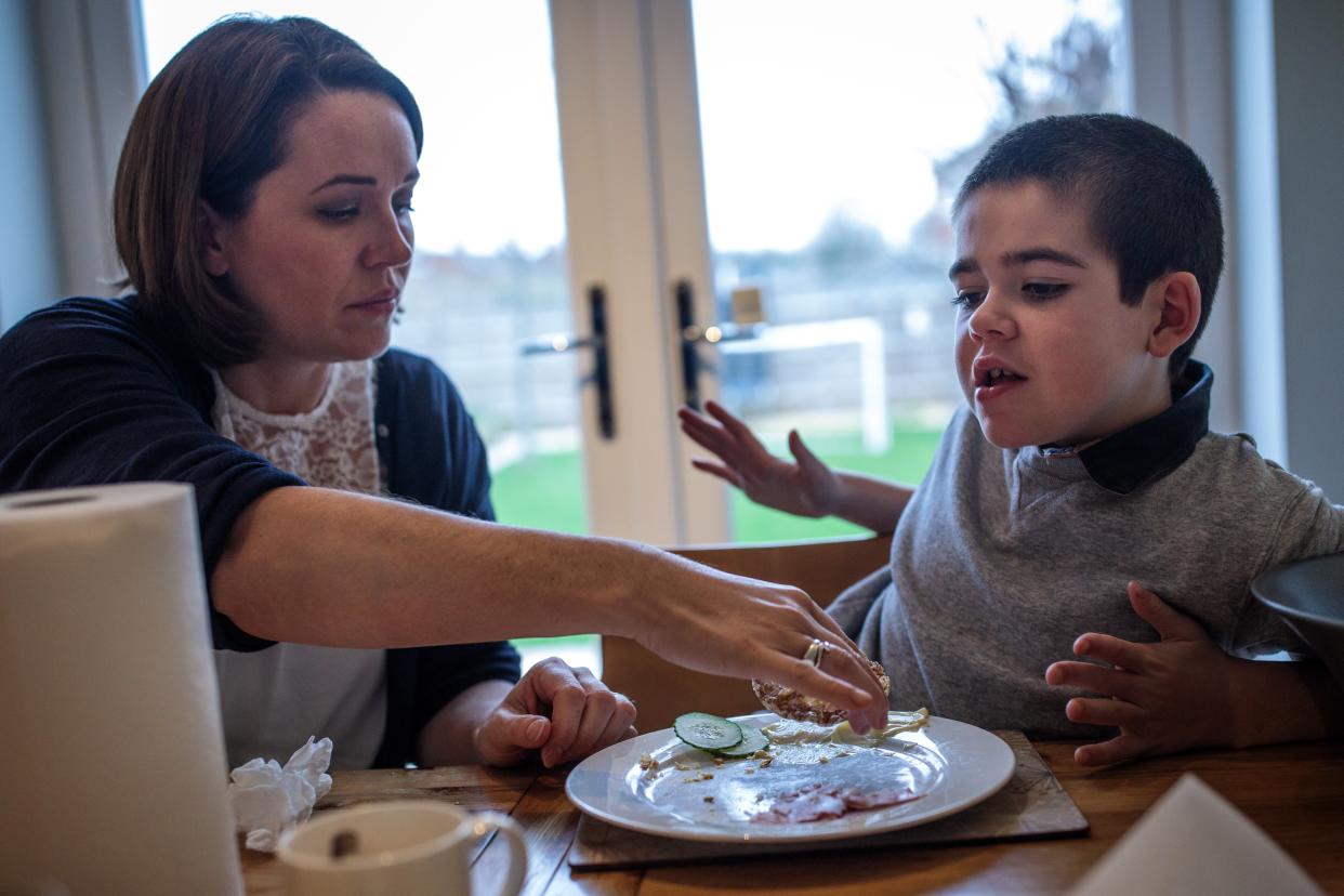 <p>Alfie Dingley with his mother Hannah Deacon at their home in Kenilworth</p> (Getty Images)