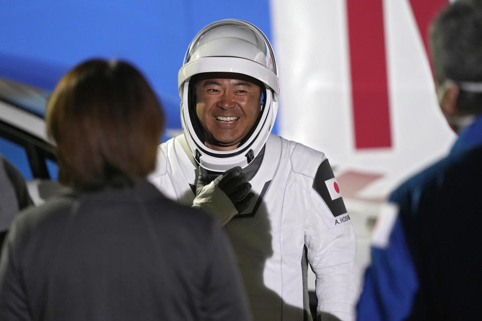 Japan Aerospace Exploration Agency astronaut Akihiko Hoshide smiles as he talks to family and friends after leaving the operations and checkout building before a launch attempt Friday, April 23, 2021, at the Kennedy Space Center in Cape Canaveral, Fla. Four astronauts will fly on the SpaceX Crew mission to the International Space Station scheduled for launch on April 23, 2021. (AP Photo/John Raoux)