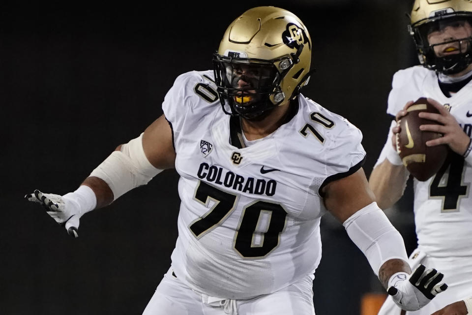 FILE - Colorado offensive lineman Casey Roddick (70) plays in the first half during an NCAA college football game against Arizona, Saturday, Dec. 5, 2020, in Tucson, Ariz. Colorado offensive lineman Casey Roddick nearly had his football career ended after a case of COVID-19 developed into a serious bout with myocarditis, an inflammation of the heart wall. These days, the left guard from California doesn't take even one snap for granted. That's why he relished his new role as team captain. (AP Photo/Rick Scuteri, File)