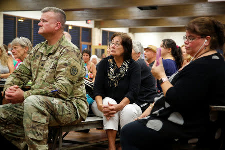 Puna district residents attend a community meeting during ongoing eruptions of the Kilauea Volcano at Pahoa High and Intermediate School in Pahoa, Hawaii, U.S., May 7, 2018. REUTERS/Terray Sylvester