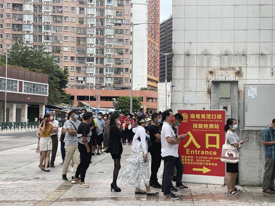 MACAO, CHINA - JUNE 19: People queue up for COVID-19 nucleic acid tests on June 19, 2022 in Macao, China. (Photo by VCG/VCG via Getty Images)