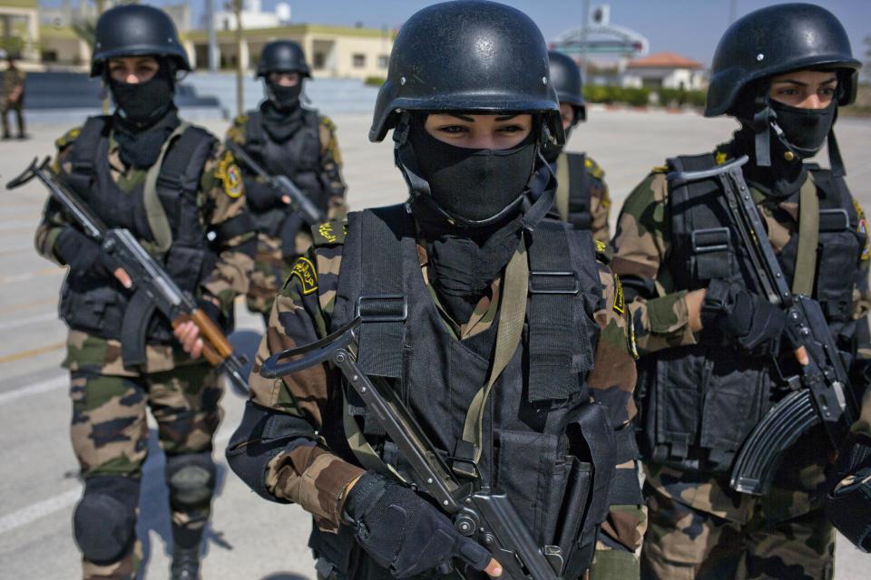 In this Sunday, April 6, 2014 photo, Palestinian women who will become a part of the elite Presidential Guard stand during a training in Jericho, West Bank. Twenty-five Palestinian women are set to become the first female members of the Presidential Guards, a Palestinian elite force of 2,600 men. (AP Photo/Dusan Vranic)