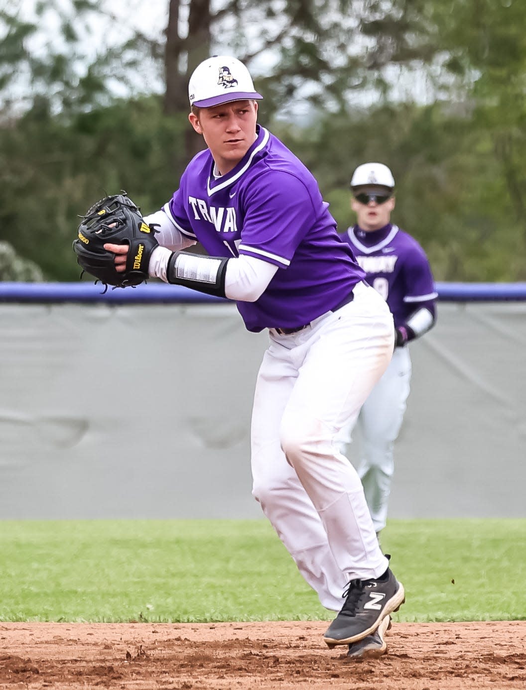 Triway's Grant Schag fires this throw across the diamond for the out.