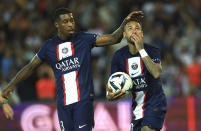 PSG's Presnel Kimpembe, left, and PSG's Neymar celebrate after scoring during the French League One soccer match between Paris Saint-Germain and Monaco at the Parc des Princes in Paris, France, Sunday, Aug. 28, 2022. (AP Photo/Aurelien Morissard)