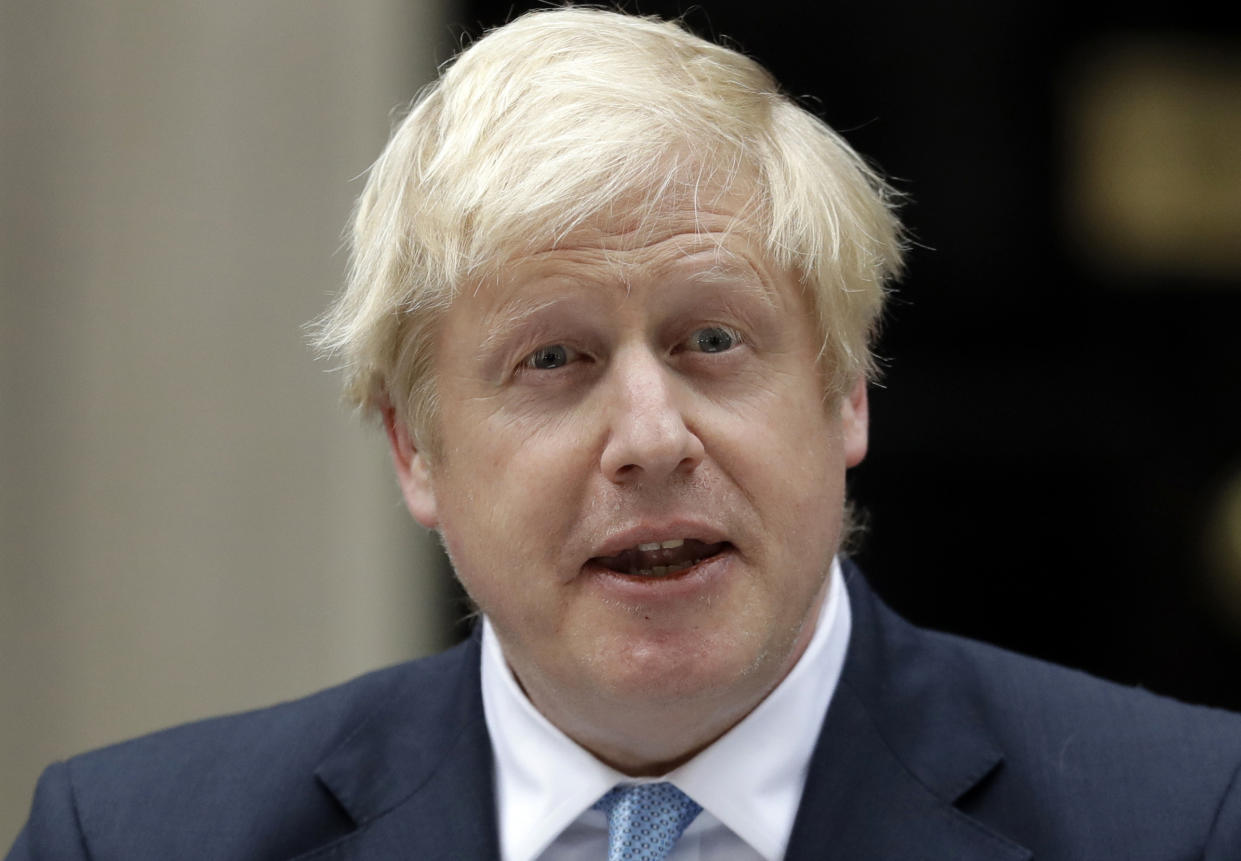 Britain's Prime Minister Boris Johnson speaks to the media outside 10 Downing Street in London, Monday, Sept. 2, 2019. Johnson says he doesn't want an election amid Brexit crisis and issued a rallying cry to lawmakers to back him in securing Brexit deal. (AP Photo/Matt Dunham)