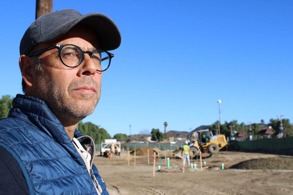 Developer Vince Daly looks at the 2-acre site where his company's High Street Depot will rise in Moorpark. Around him was a crew working on underground infrastructure.