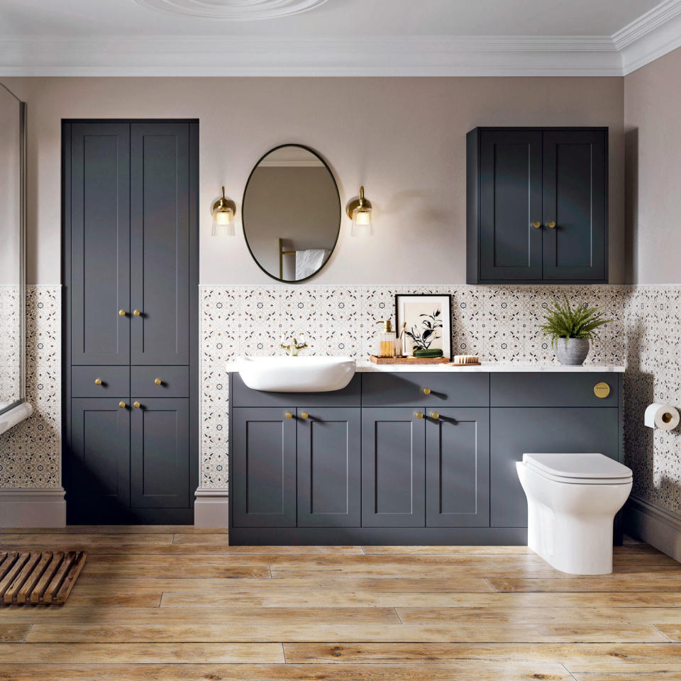 Classic bathroom with wood flooring, white patterned wall tiles and grey shaker-style fitted bahroom furniture