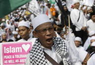 <p>A muslim protester shouts slogans during a protest against Jakarta’s Christian Governor Basuki “Ahok” Tjahaja Purnama in Jakarta, Indonesia, May 5, 2017. Thousands of conservative Muslims took to the streets of the Indonesian capital to call for the jailing of the minority Christian governor who is on trial on charges of blaspheming the Quran. (Photo: Achmad Ibrahim/AP) </p>