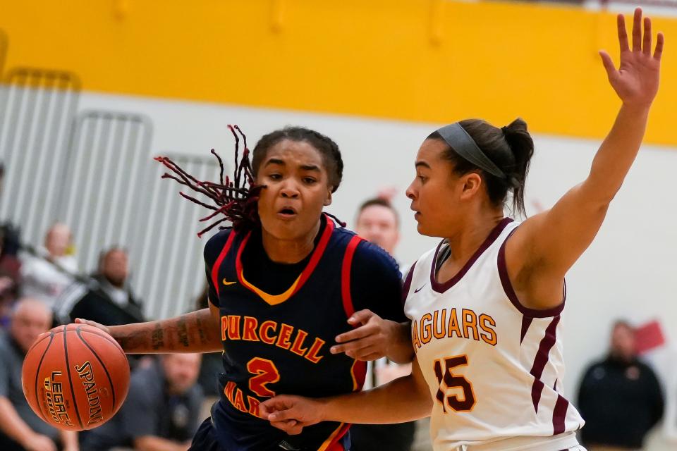 Purcell Marian's Dee Alexander, left, is the two-time reigning Ms. Basketball and is the No. 4 ranked junior in the nation.