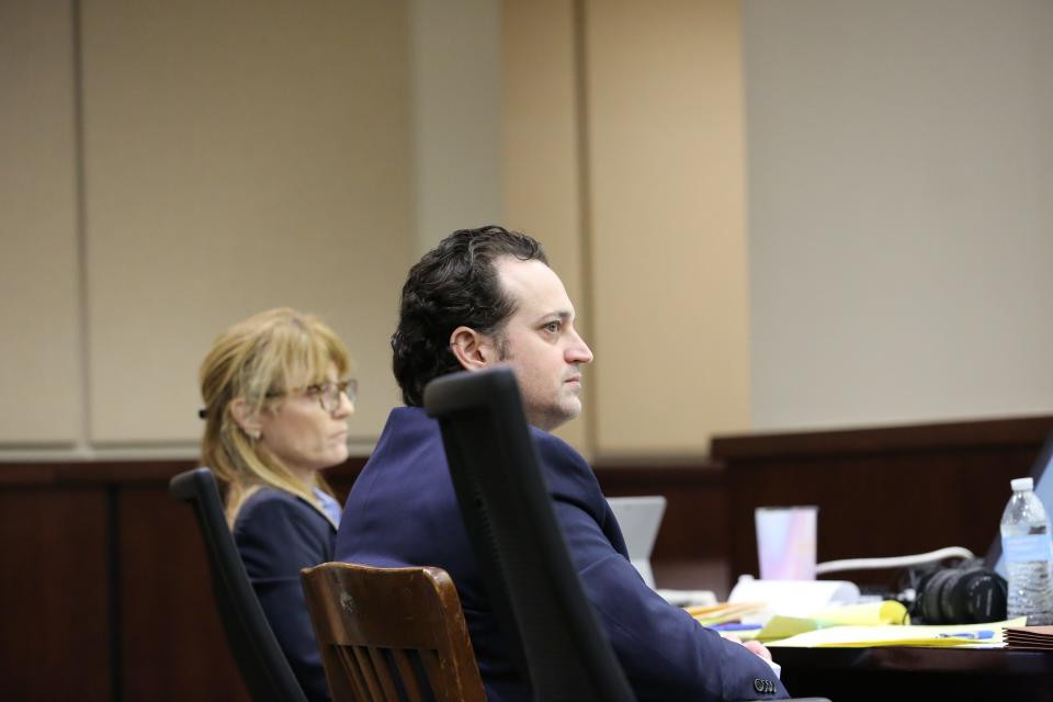 Charlie Adelson listens as his attorney, Daniel Rashbaum, presents an opening statement to the jury, Oct. 26, 2023.