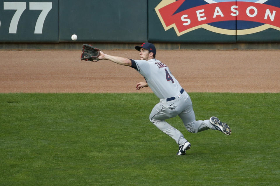 Cleveland Indians center fielder Bradley Zimmer makes a catch of a fly ball hit by Minnesota Twins' Luis Arraez in the fourth inning of a baseball game Saturday, Aug. 1, 2020, in Minneapolis. (AP Photo/Bruce Kluckhohn)