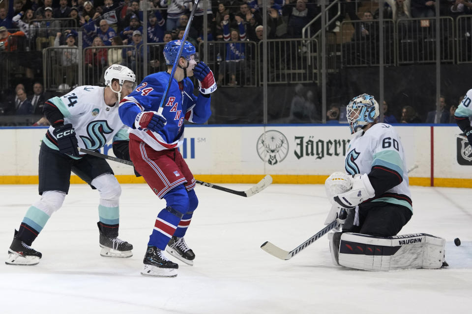 New York Rangers right wing Kaapo Kakko (24) reacts after scoring against Seattle Kraken goaltender Chris Driedger (60) during the second period of an NHL hockey game Tuesday, Jan. 16, 2024, at Madison Square Garden in New York. (AP Photo/Mary Altaffer)