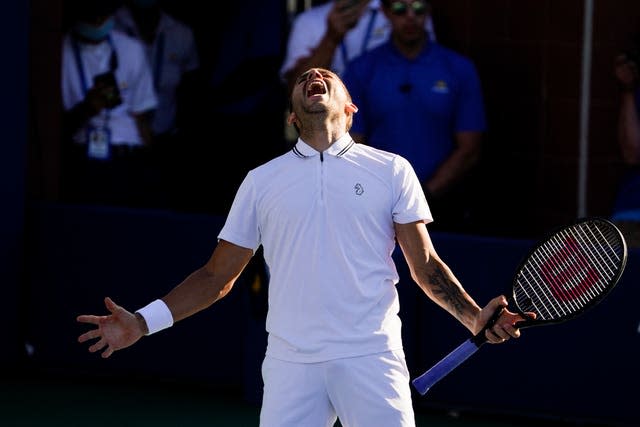 Dan Evans celebrates after beating Alexei Popyrin in a dramatic encounter