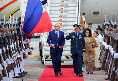 Malaysian Prime Minister Razak Najib (L) and his spouse Rosmah Mansor arrive at the Manila International Airport in Pasay city, metro Manila, Philippines April 27, 2017. REUTERS/Romeo Ranoco