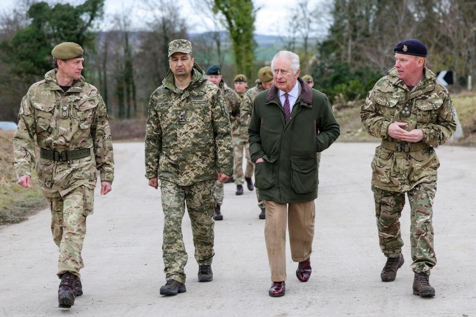 King Charles III visits a training site for Ukrainian military recruits in Wiltshire, England, on February 20, 2023.
