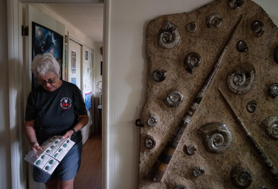 Carolyn Shafer, with the Patagonia Area Resource Alliance, holds turquoise she mined from the claim she used to own in the area on June 18, 2023, in Patagonia.