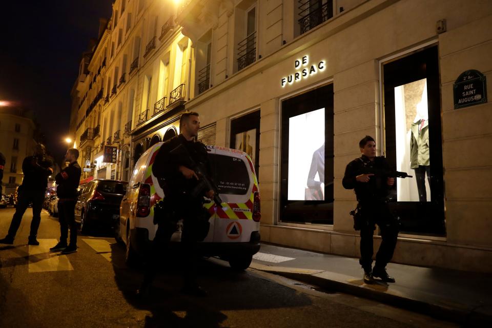 <p>Policemen stand guard in Paris centre after one person was killed and several injured in a knife attack in Paris on May 12, 2018. (Photo: Thomas Samson/AFP/Getty Images) </p>