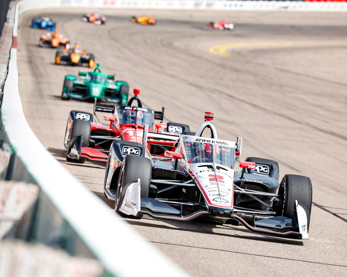 The 2 car driven by Josef Newgarden leads cars down the backstretch in the IndyCar Hy-VeeDeals.com 250 at the Iowa Speedway in Newton, Iowa, on July 23, 2022.