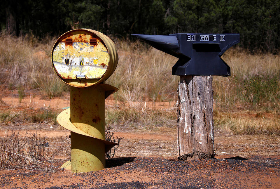 <p>An old oil drum and an anvil that have been converted into mailboxes are seen in the outskirts of Walgett township, northwest of Sydney, Australia. (Photo: David Gray/Reuters) </p>