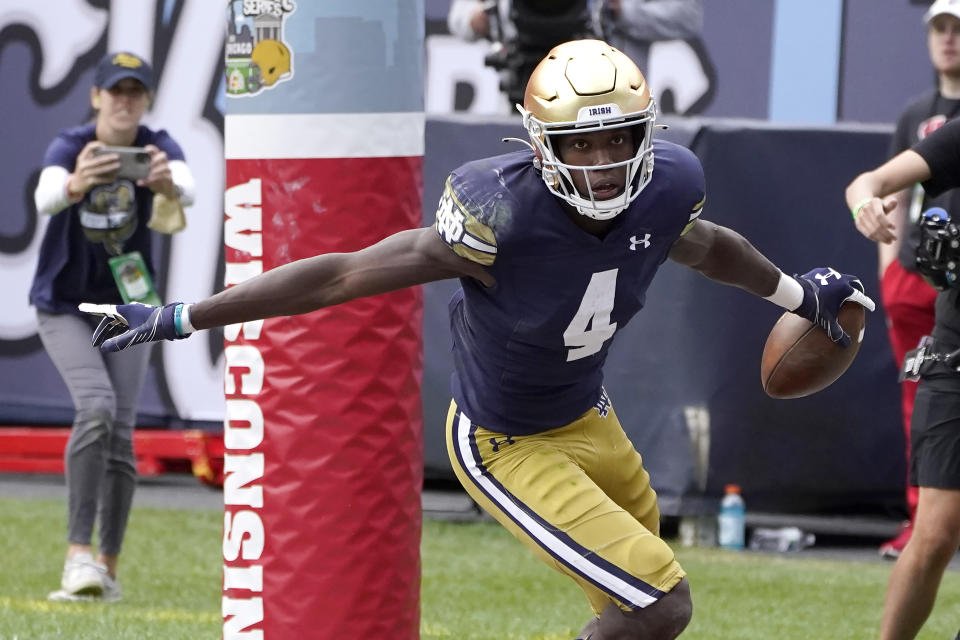 Notre Dame wide receiver Kevin Austin Jr. celebrates his touchdown reception from quarterback Drew Pyne during the second half of an NCAA college football game against Wisconsin Saturday, Sept. 25, 2021, in Chicago. Notre Dame won 41-13. (AP Photo/Charles Rex Arbogast)