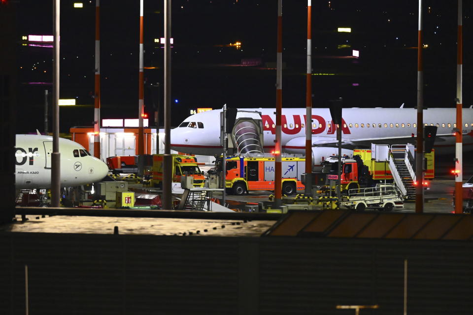 Fire Department vehicles arrive at a security scene at the Hamburg Airport, Saturday, Nov. 4, 2023, in Hamburg, Germany. The airport was closed to passengers, and flights were canceled Saturday night after a vehicle broke through security and entered the premises, German news agency dpa reported. (Jonas Walzberg/dpa via AP)