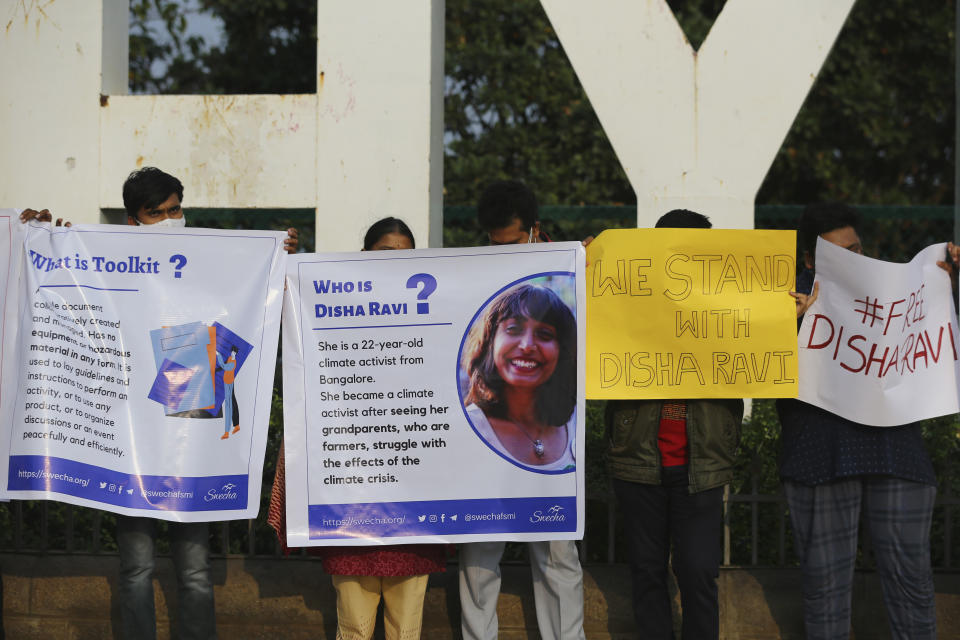 Activists participate in a silent protest against the arrest of environmental activist Disha Ravi in Hyderabad, India, Saturday, Feb. 20, 2021. The 22-year-old Indian climate activist who is facing sedition charges for her alleged role in the creation of an online document intended to help amplify farmer protests did not get bail Saturday after a court said it will reserve its order for next week. (AP Photo/Mahesh Kumar A.)