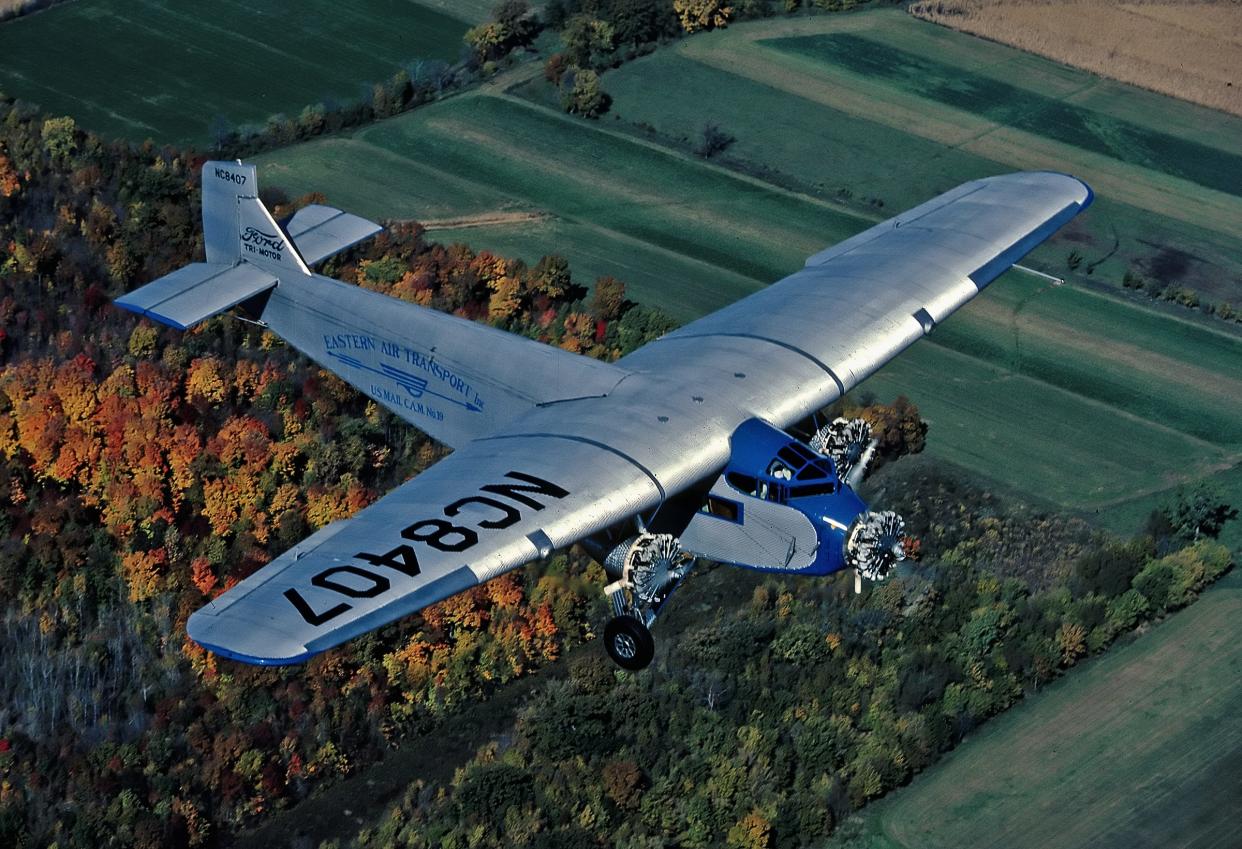 The Experimental Aircraft Association's Ford Tri-Motor flies over the fall colors in Wisconsin.