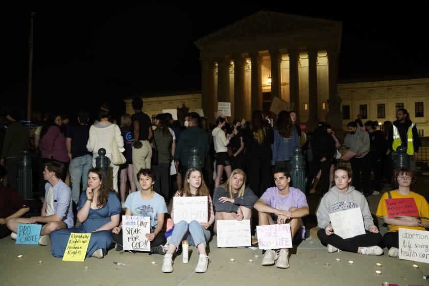 A crowd gathers outside the Supreme Court on Monday night after a purported leak says that Roe vs. Wade will be overturned on May 2, 2022.