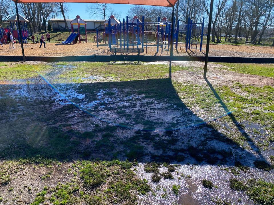 After a recent rain, puddles gathered on the Powell Elementary playground.