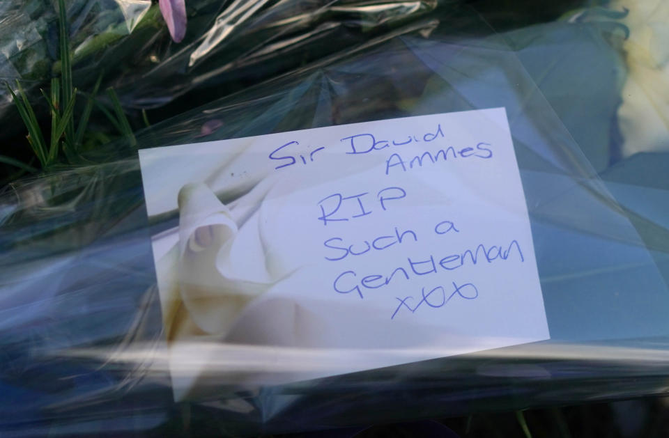 Flowers at the scene near the Belfairs Methodist Church in Eastwood Road North, Leigh-on-Sea, Essex, where Conservative MP Sir David Amess has died after he was stabbed several times at a constituency surgery. A man has been arrested and officers are not looking for anyone else. Picture date: Friday October 15, 2021.