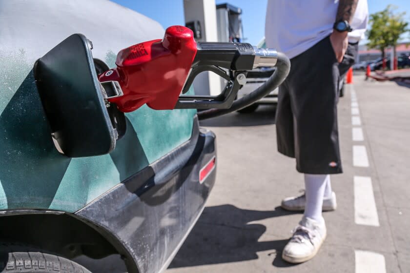 Azusa, CA, Tuesday, March 22, 2022 - Jorge Garcia fills up for $68 at Costco, where regular grade costs $5.39 per gallon. (Robert Gauthier/Los Angeles Times)