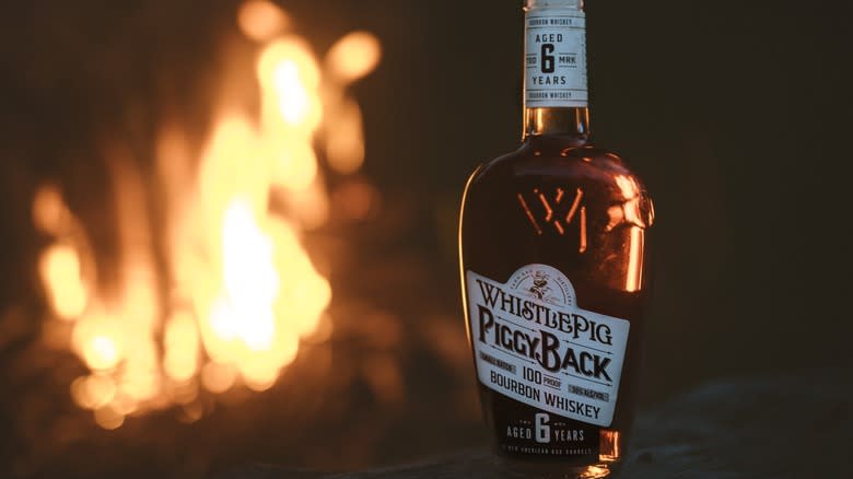 whistlepig bourbon by fireplace