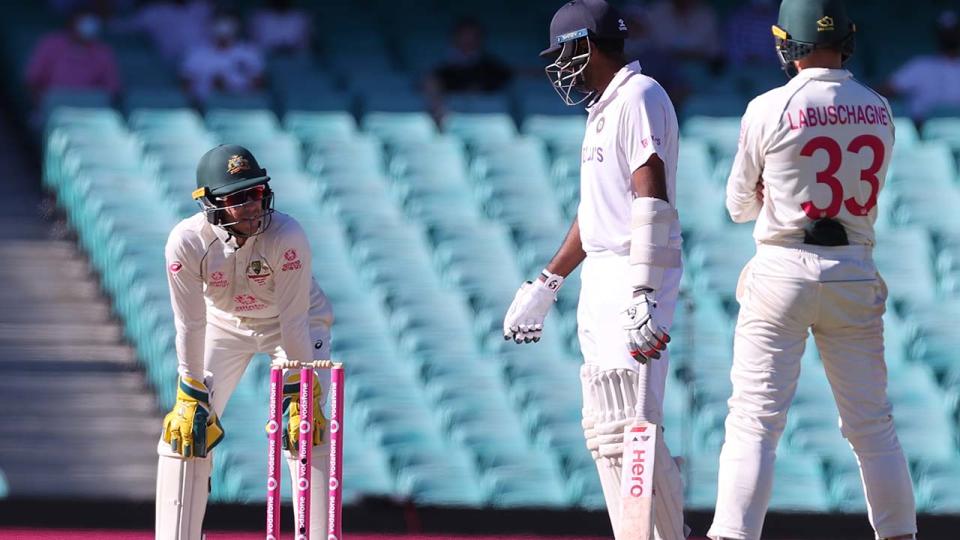 Ravichandran Ashwin, pictured here speaking with Tim Paine during the fifth day of the Sydney Test. 