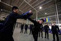 Trainees from Dewei Security attend boxing training at a training camp, on the outskirts of Beijing, China March 2, 2017. REUTERS/Jason Lee