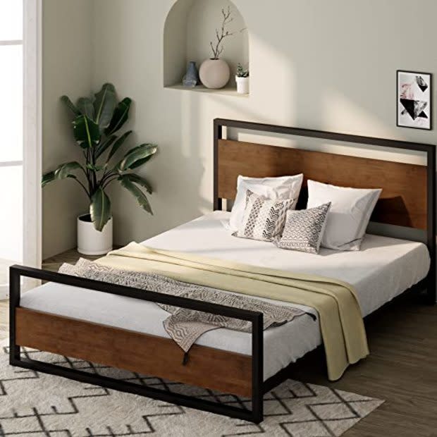 <p><a href="https://www.amazon.com/Zinus-Ironline-Platform-Headboard-Footboard/dp/B075FBJXZ7?th=1&linkCode=ll1&tag=parade03-20&linkId=3764c5a12924193fa1925f314a1fe9d4&language=en_US&ref_=as_li_ss_tl" rel="nofollow noopener" target="_blank" data-ylk="slk:Amazon;elm:context_link;itc:0;sec:content-canvas" class="link ">Amazon</a></p>