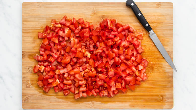 Diced tomatoes on a chopping board