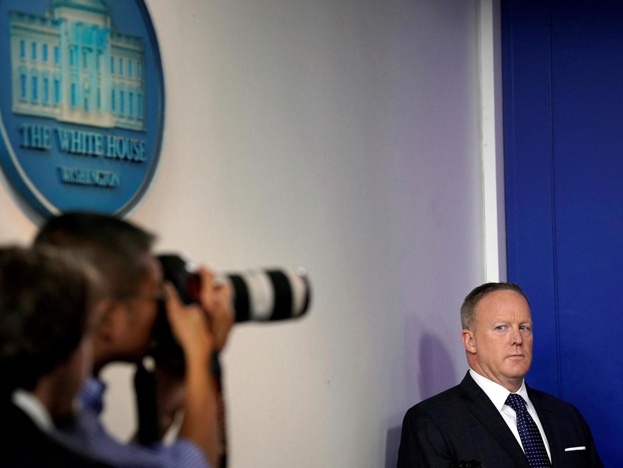 White House Press Secretary Sean Spicer looks at a photographer during the daily briefing: Reuters