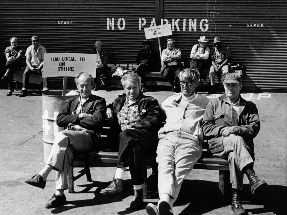 Pickets from the International Longshoremen's and Warehousemen's union sit in front of Pier 39's closed doors on San Francisco's waterfront during the first major longshoremen's strike in nine years, July 2, 1971. Pacific Maritime Association spokesmen said that virtually all operations, excepting military cargo and passenger vessels, were at a standstill along the entire Pacific Coast.