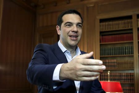 Greek Prime Minister Alexis Tsipras welcomes Egyptian Defense Minister General Sedki Sobhi (not pictured) at his office in Athens, June 12, 2015. REUTERS/Alkis Konstantinidis