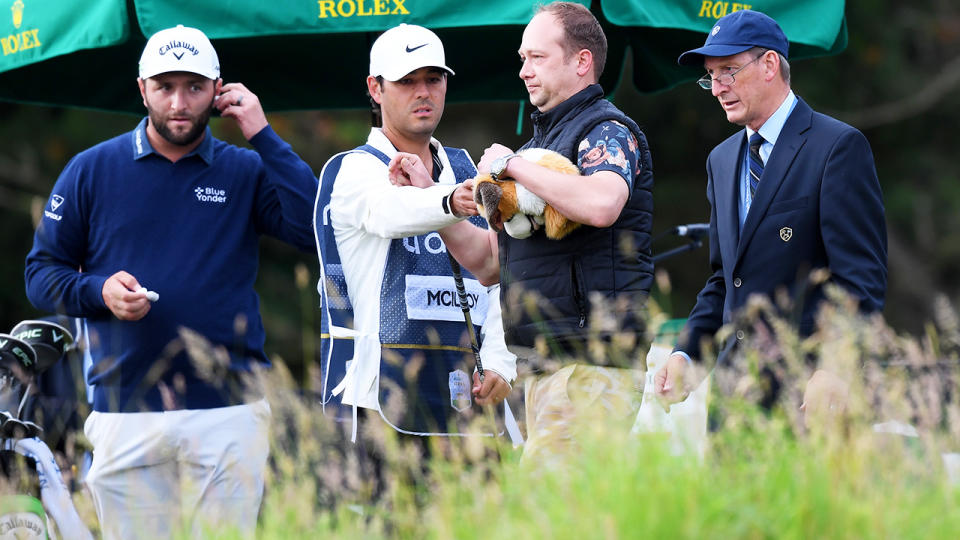 The spectator, pictured here being removed by security at the Scottish Open.