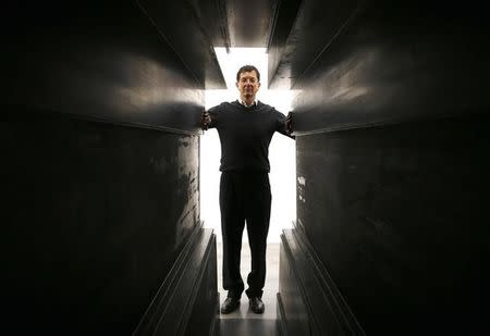 Artist Antony Gormley stands at the entrance to one of his works called "Passage", forming part of an exhibition entitled "Fit", at the White Cube gallery in London, Britain September 29, 2016. REUTERS/Peter Nichollsx