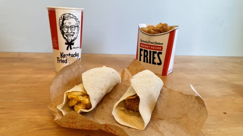 Two wraps with fries and a drink