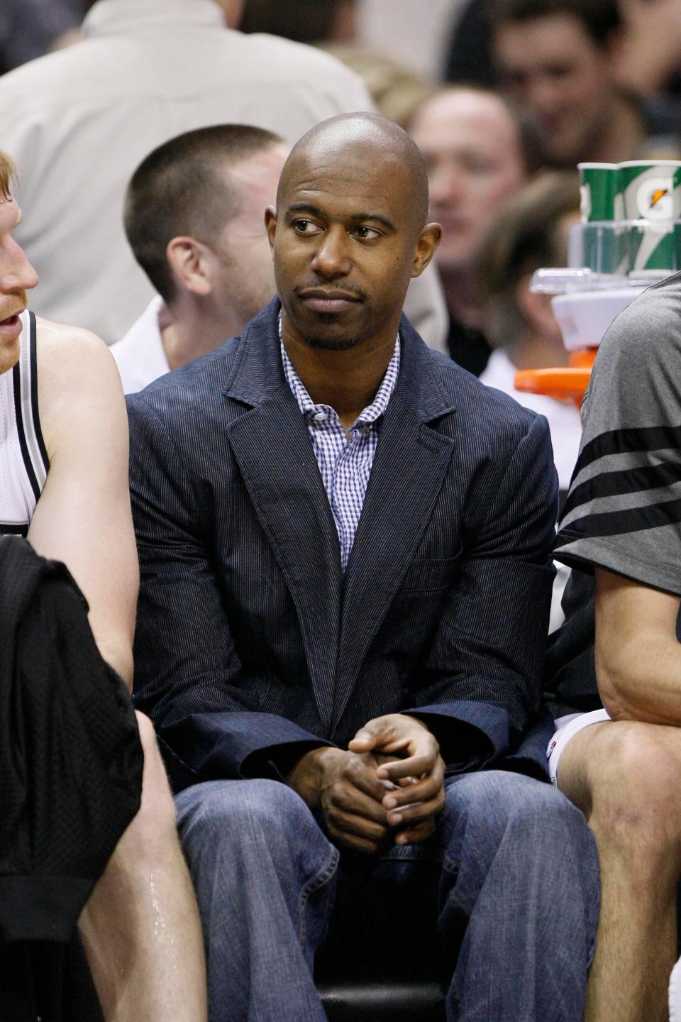 Then-Spurs guard T.J. Ford watches from the bench during a 2012 game. Ford, who led Texas to the 2003 Final Four, played with San Antonio briefly before retiring but considers the NBA franchise his family. He was honored Thursday night during the Spurs' game at Moody Center.
