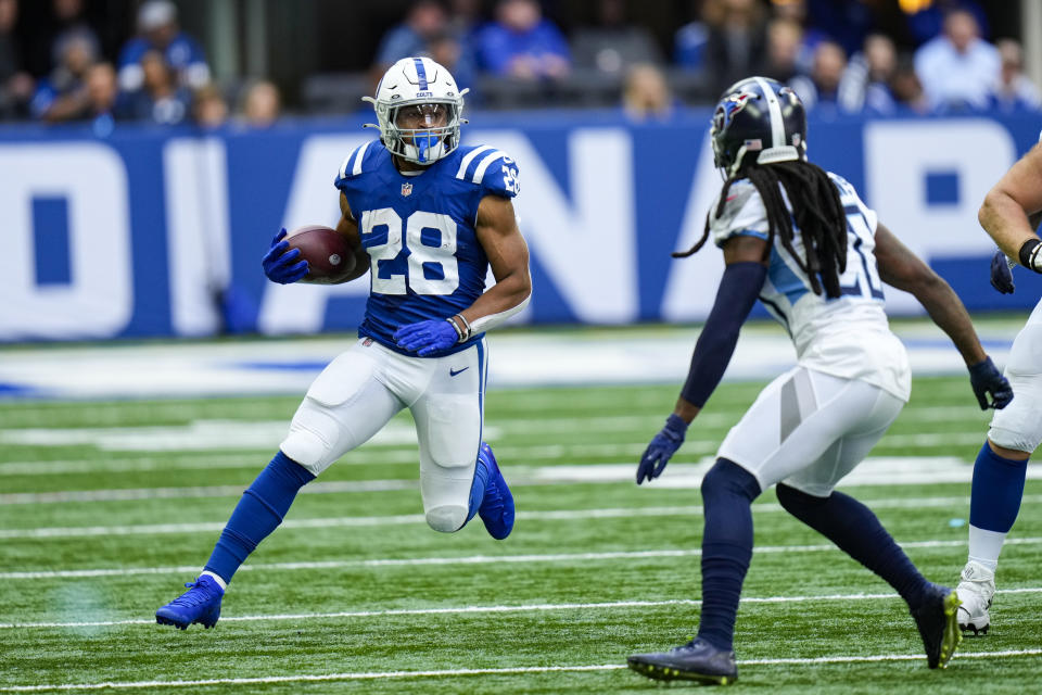 Indianapolis Colts running back Jonathan Taylor (28) tries to cut around Tennessee Titans cornerback Janoris Jenkins (20) in the first half of an NFL football game in Indianapolis, Sunday, Oct. 31, 2021. (AP Photo/AJ Mast)